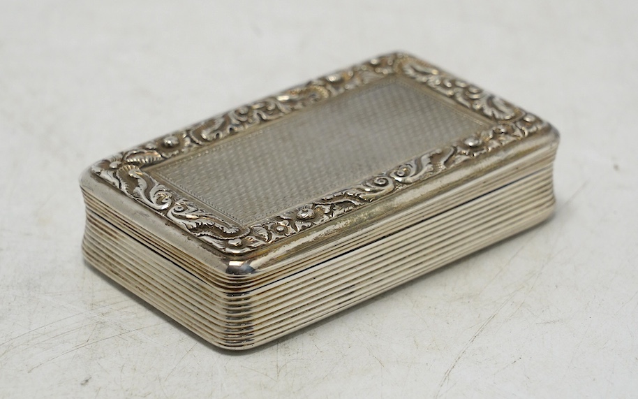 A late George III engine turned silver snuff box, William Elliot, London, 1819, 74mm, with interior engraved inscription. Condition - fair to good